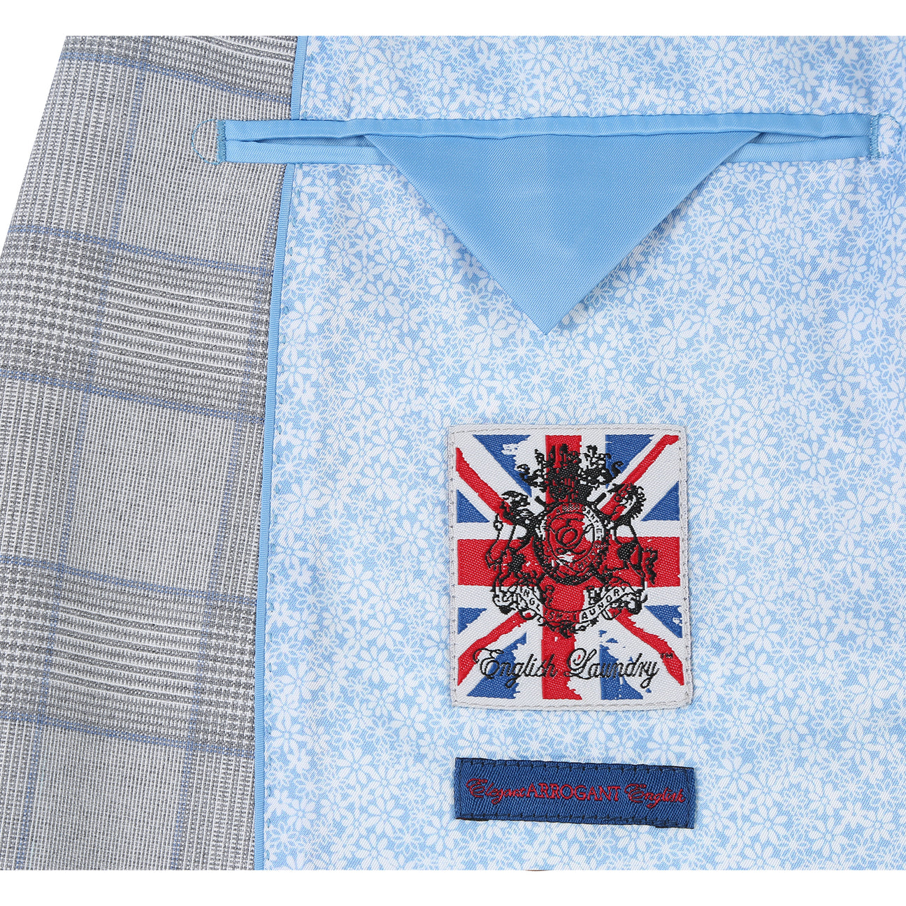 The English Laundry ENGLISH LAUNDRY TR Suit 12-66-092EL slim fit light gray plaid jacket, with a two-button closure, is displayed on a mannequin, paired with a white dress shirt and dark gray tie.