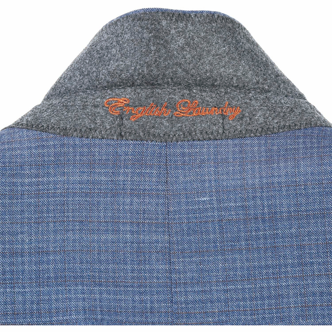 The ENGLISH LAUNDRY Pale Blue Wool Suit EL82-60-402, featuring a slim fit with a subtle check pattern and stylish notch lapels, pairs perfectly with a crisp white dress shirt and an orange patterned tie, elegantly displayed on a mannequin.