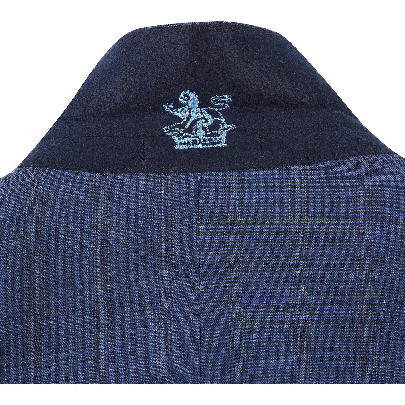 The ENGLISH LAUNDRY Blue Check Suit 22-52-402EL by English Laundry features a slim fit jacket with notch lapels and two-button closure, shown with a white dress shirt and red patterned tie on a mannequin.