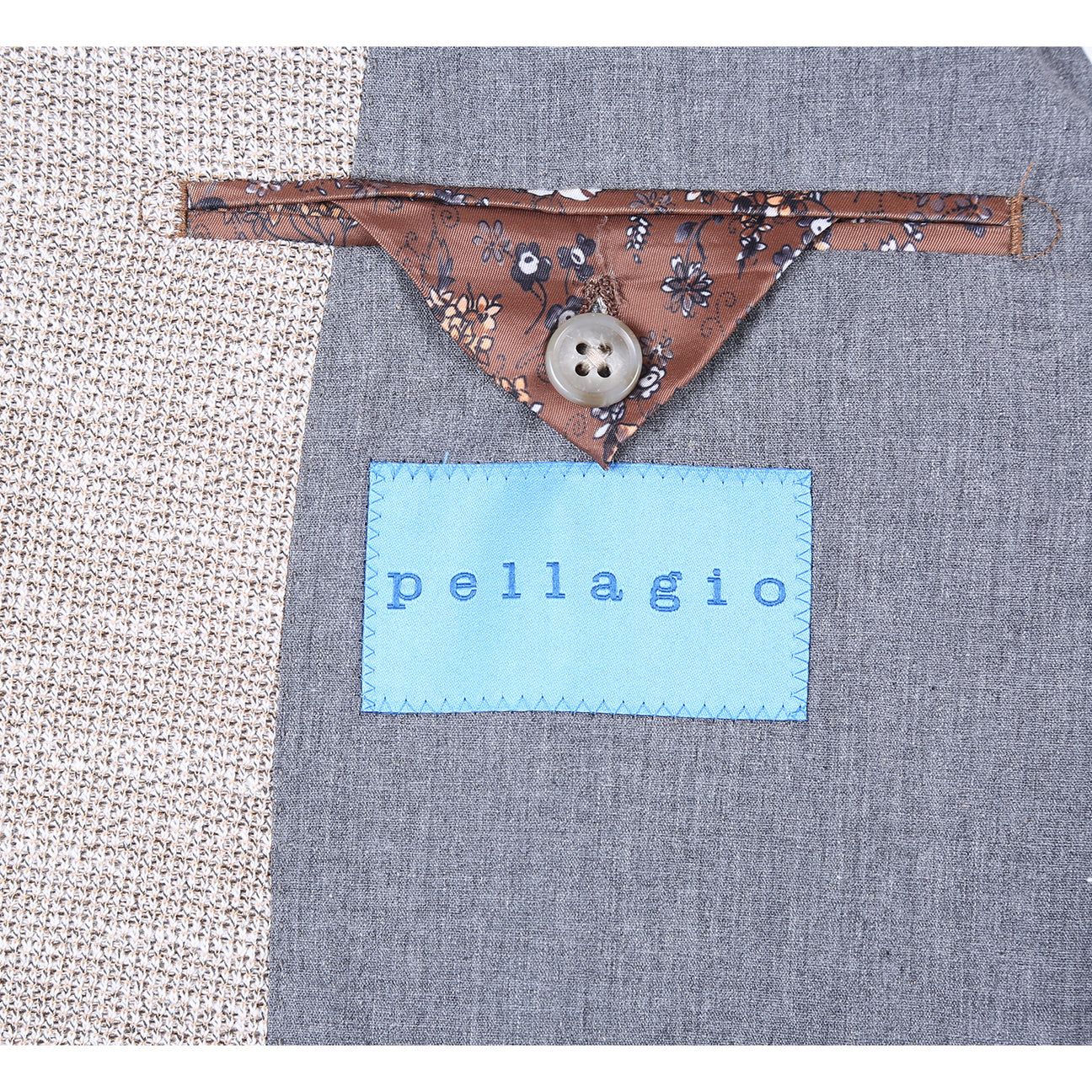 The Pellagio Camel Men's Slim Fit Riserva Jacket PS26-10 features textured fabric, notch lapels, two buttons, front pockets, and comes with a brown pocket square, shown over a white shirt and patterned dark tie on a mannequin.