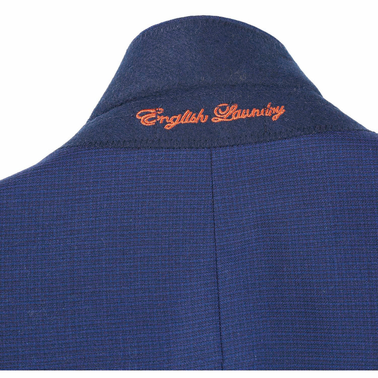 The ENGLISH LAUNDRY Blue Wool Suit EL82-22-411 by English Laundry, with its slim-fit design, is stylishly displayed on a mannequin alongside a crisp white shirt and an orange patterned tie.