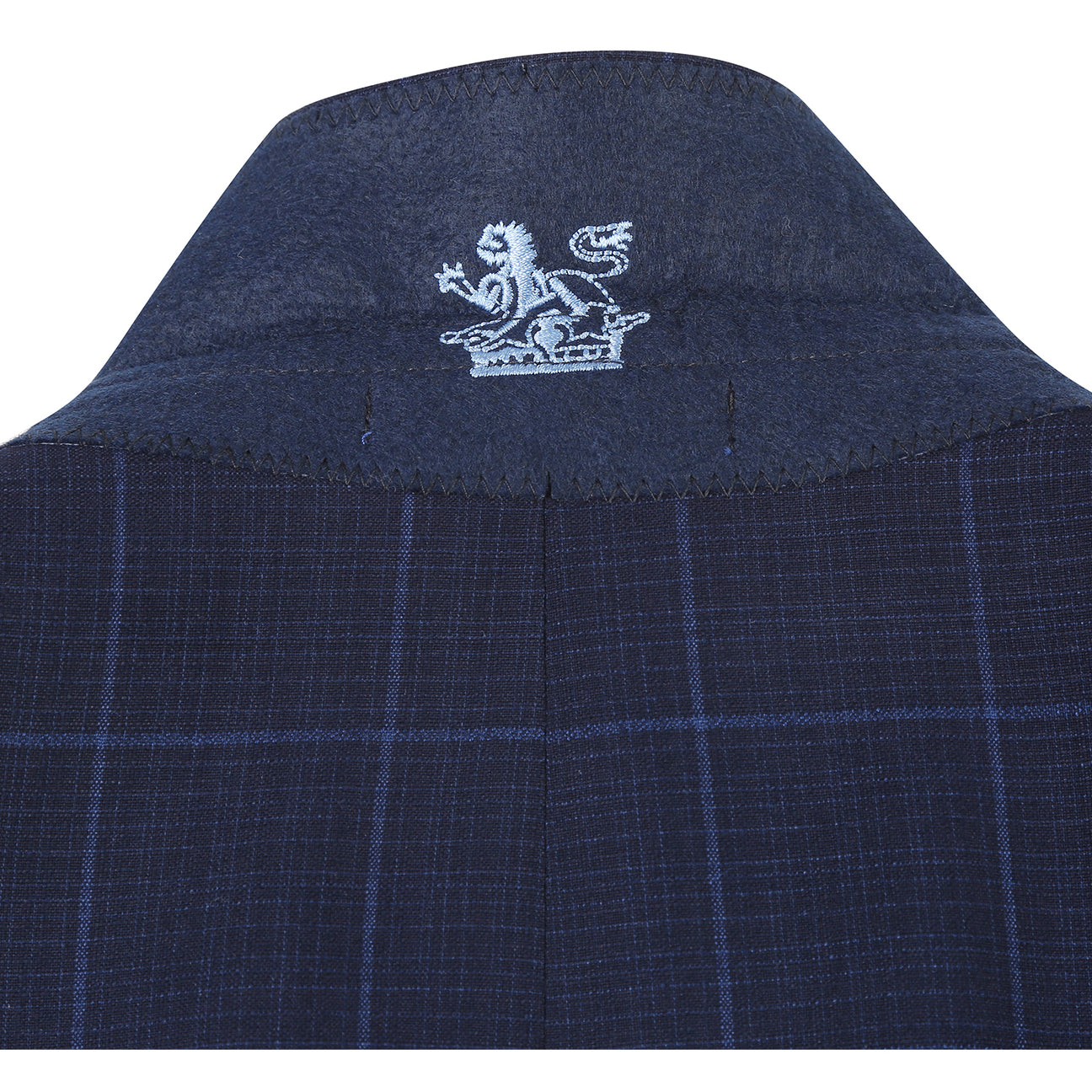 The ENGLISH LAUNDRY Midnight Blue Check Suit 12-55-410EL by English Laundry, featuring a slim fit jacket with notch lapels, is paired with a white dress shirt and red patterned tie on display.