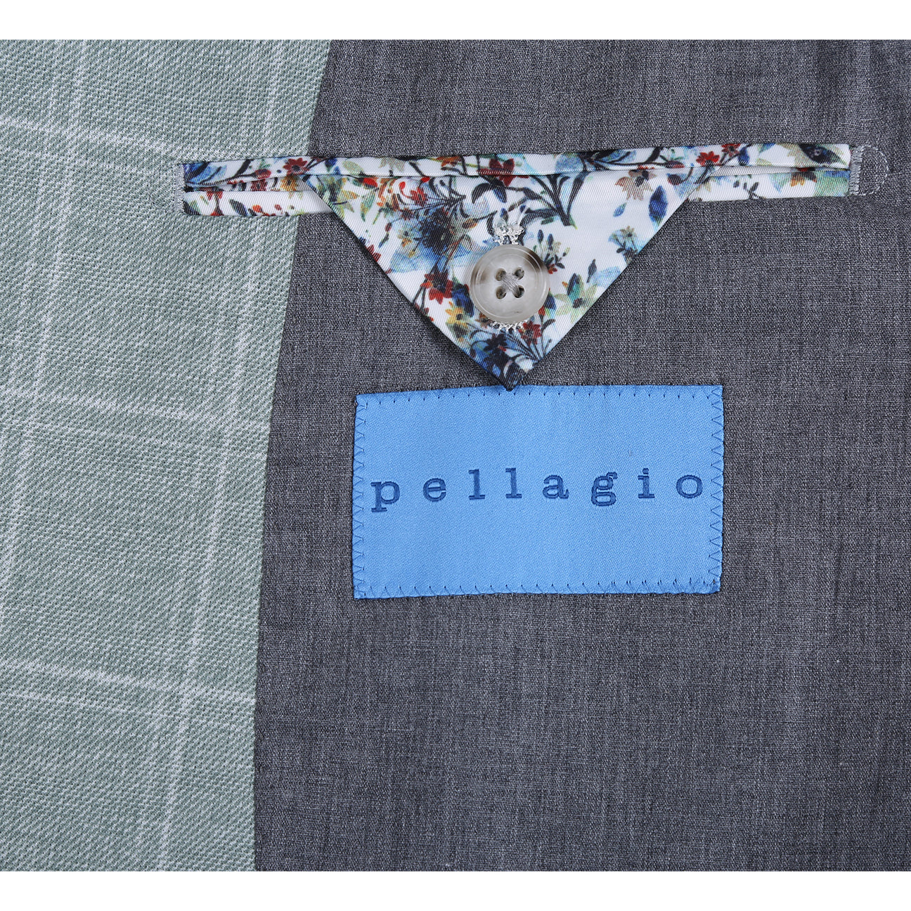 The Pellagio Light Green Men's Slim Fit Riserva Jacket PS26-9, styled with a white dress shirt, striped tie, and patterned pocket square, is displayed on a mannequin.