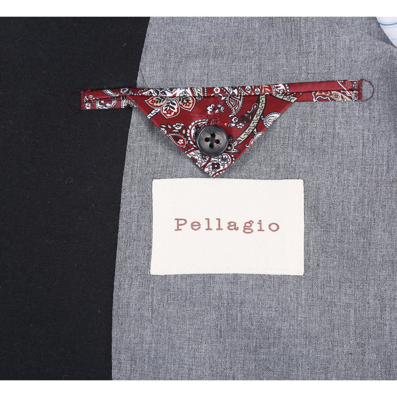 The Pellagio Men's Slim Fit Riserva Jacket Black PF25-17W by Pellagio, styled with a white dress shirt, striped orange tie, and patterned pocket square, is displayed on a headless mannequin.