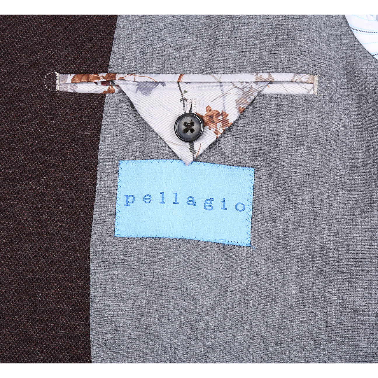 The Pellagio Men's Slim Fit Riserva Jacket Brown PF25-11 is displayed on a mannequin, styled with a white dress shirt, orange and navy striped tie, and a white pocket square.