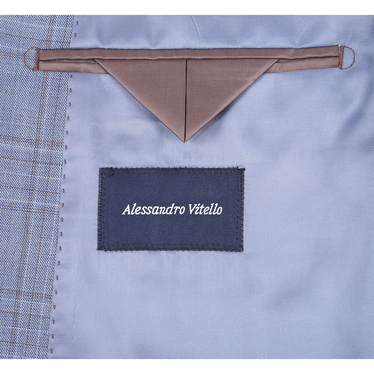 The Renoir Alessandro Vitello by Renoir Classic Fit Wool Blue Suit 568-7, featuring notch lapels, is displayed on a mannequin over a white dress shirt and navy blue patterned tie.
