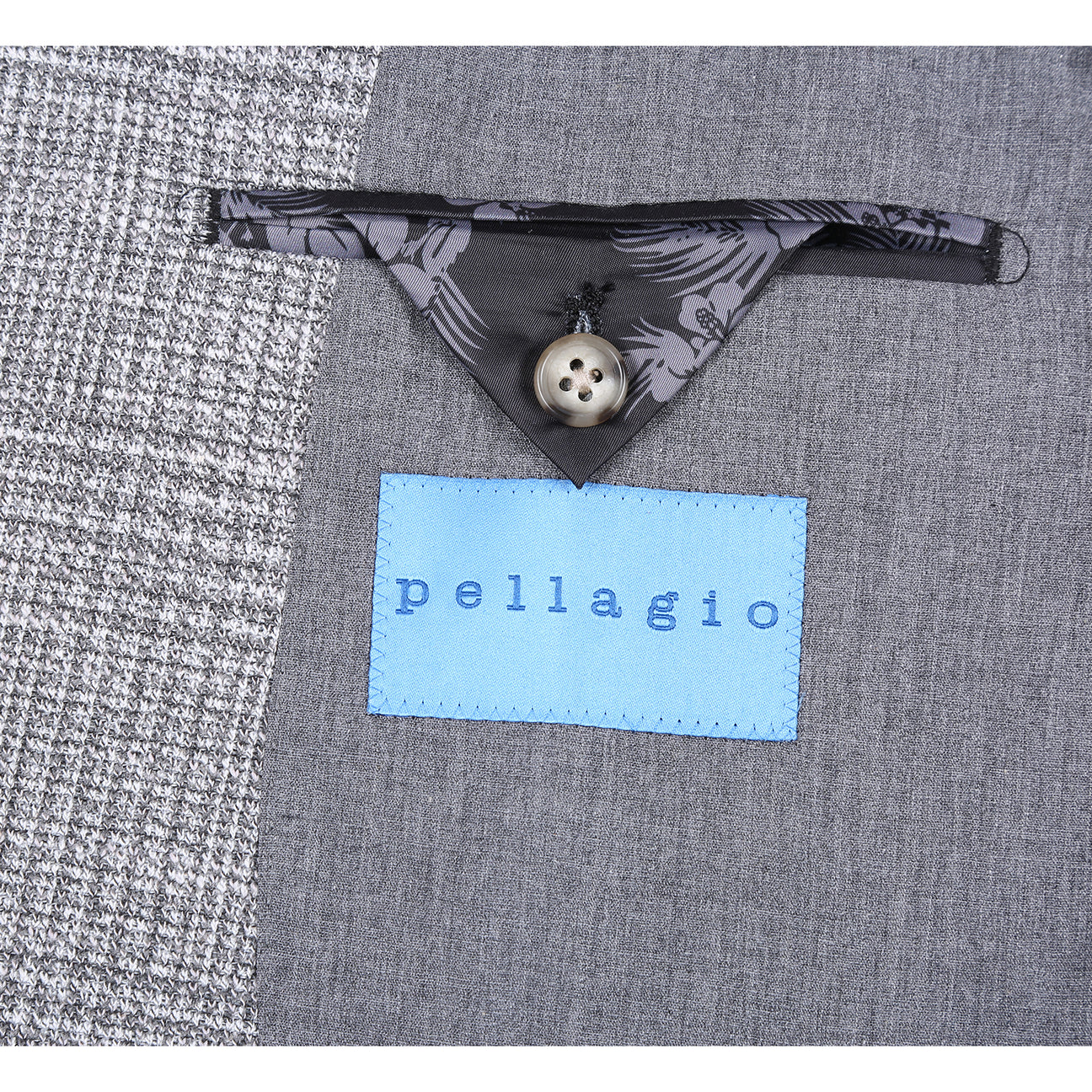 The Pellagio Light Gray Men's Slim Fit Riserva Jacket PS26-11 is styled on a mannequin with a white shirt, black tie, and black pocket square for a sleek look.