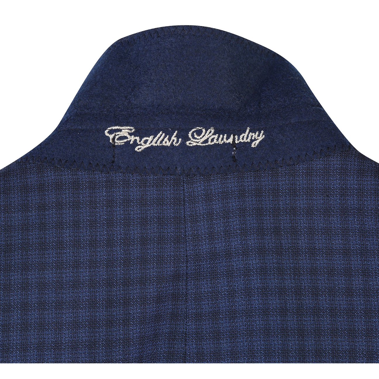 The ENGLISH LAUNDRY Wool Suit EL92-51-410 by English Laundry is a navy blue checkered slim fit jacket, shown over a white dress shirt with a red patterned tie on a headless mannequin.