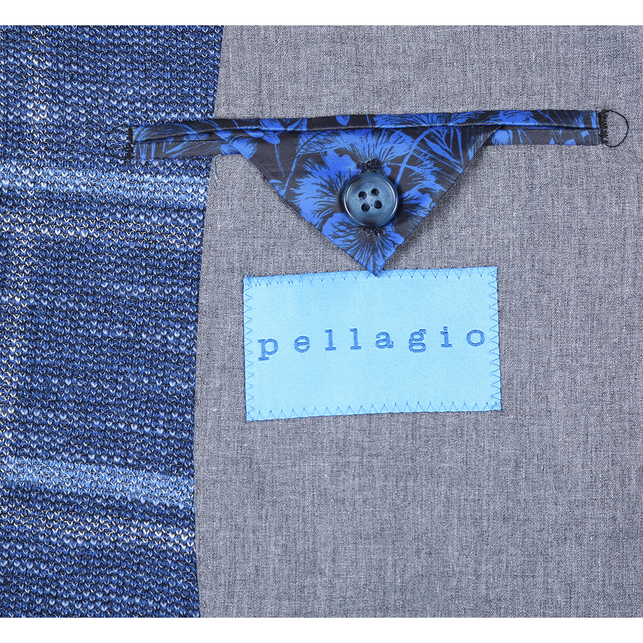 Displayed on a headless mannequin: the Pellagio Navy Blue Men's Slim Fit Riserva Jacket PS26-12, paired with a white dress shirt, orange patterned tie, and blue pocket square.