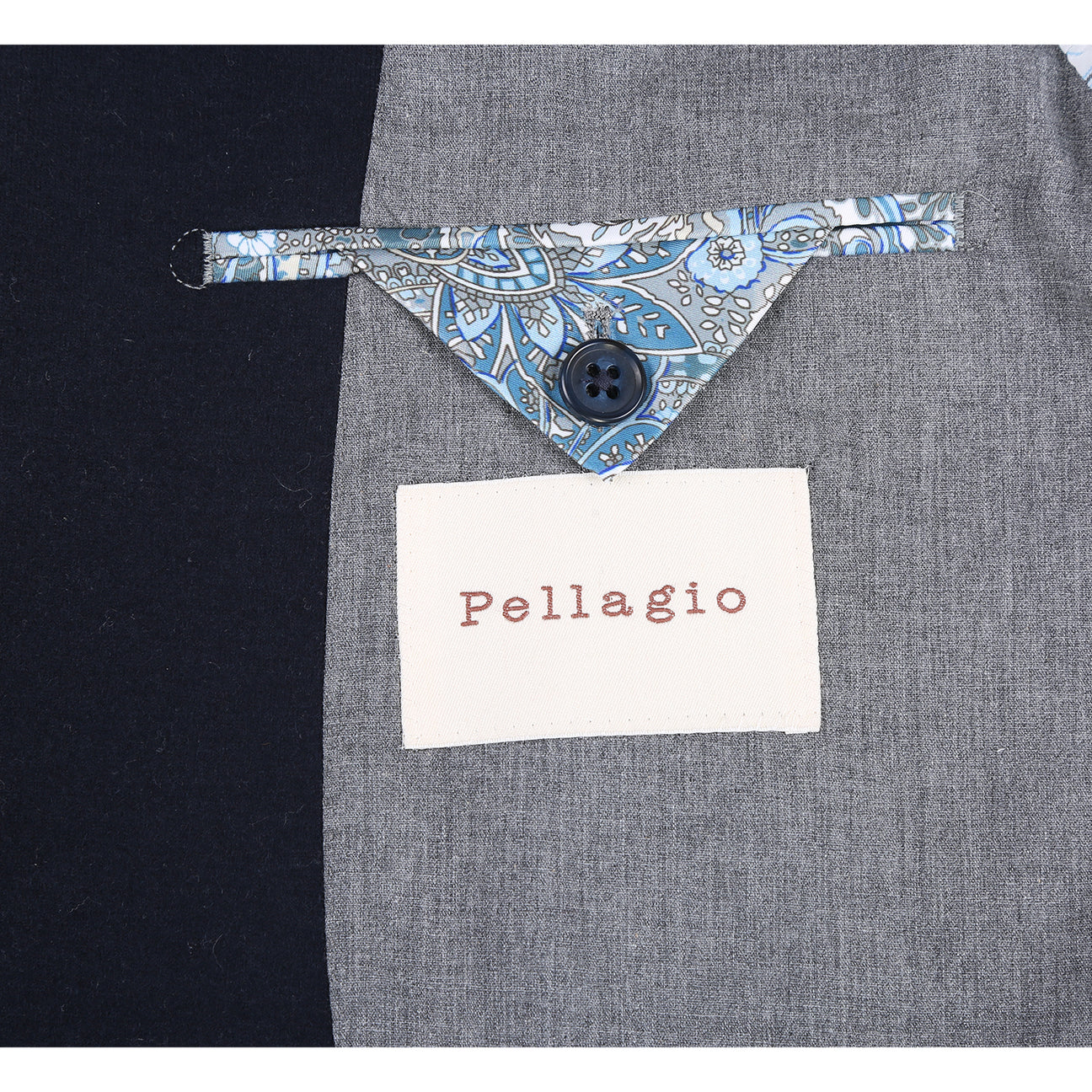 The Pellagio Men's Slim Fit Riserva Jacket Navy PF25-18W by Pellagio is displayed on a mannequin, paired with a white dress shirt, striped tie, and patterned pocket square.