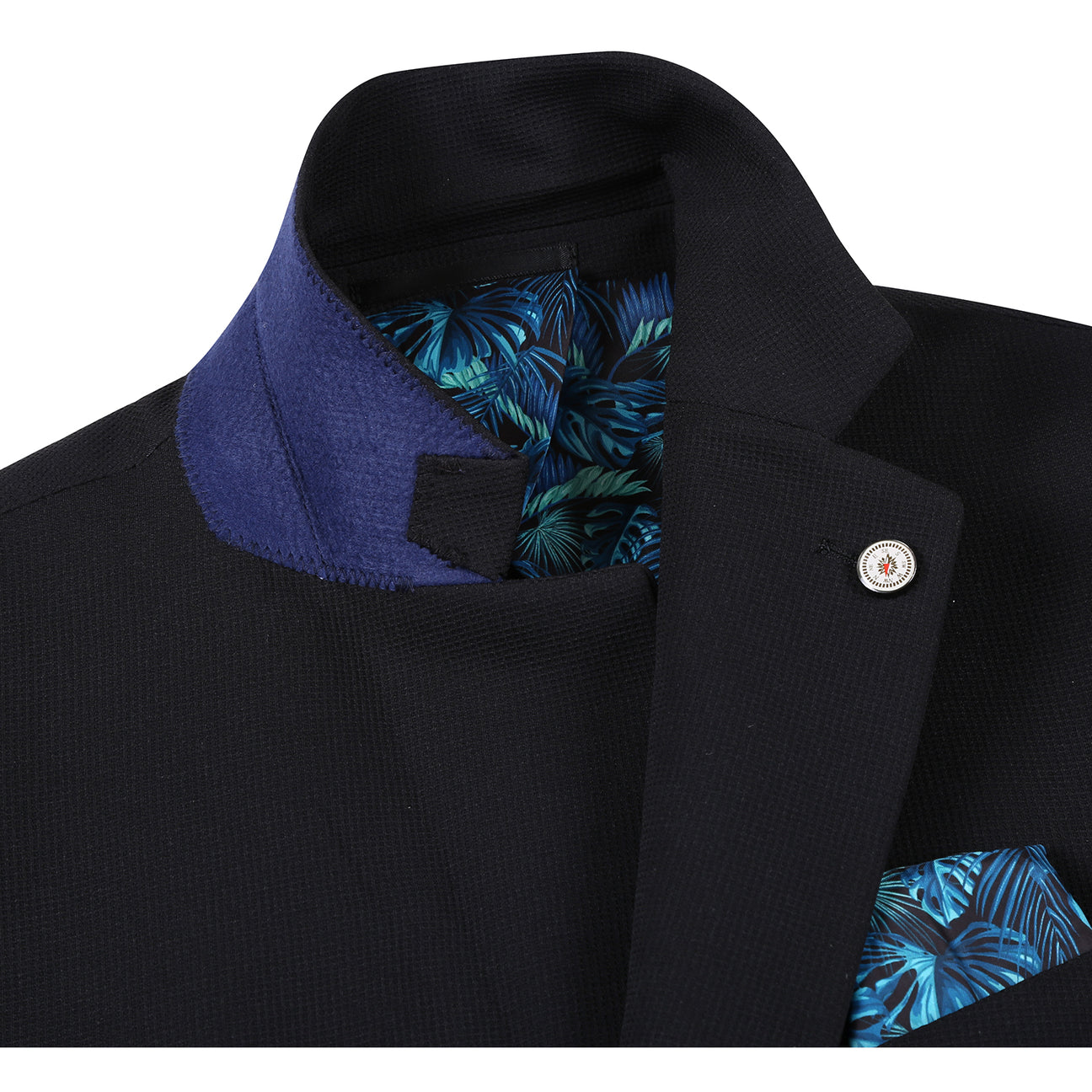 The Pellagio Men's Half Canvas Blazer Black PS25-18, a slim-fit single-breasted jacket with notched lapel, is styled on a mannequin with a white shirt, light patterned tie, and teal pocket square.