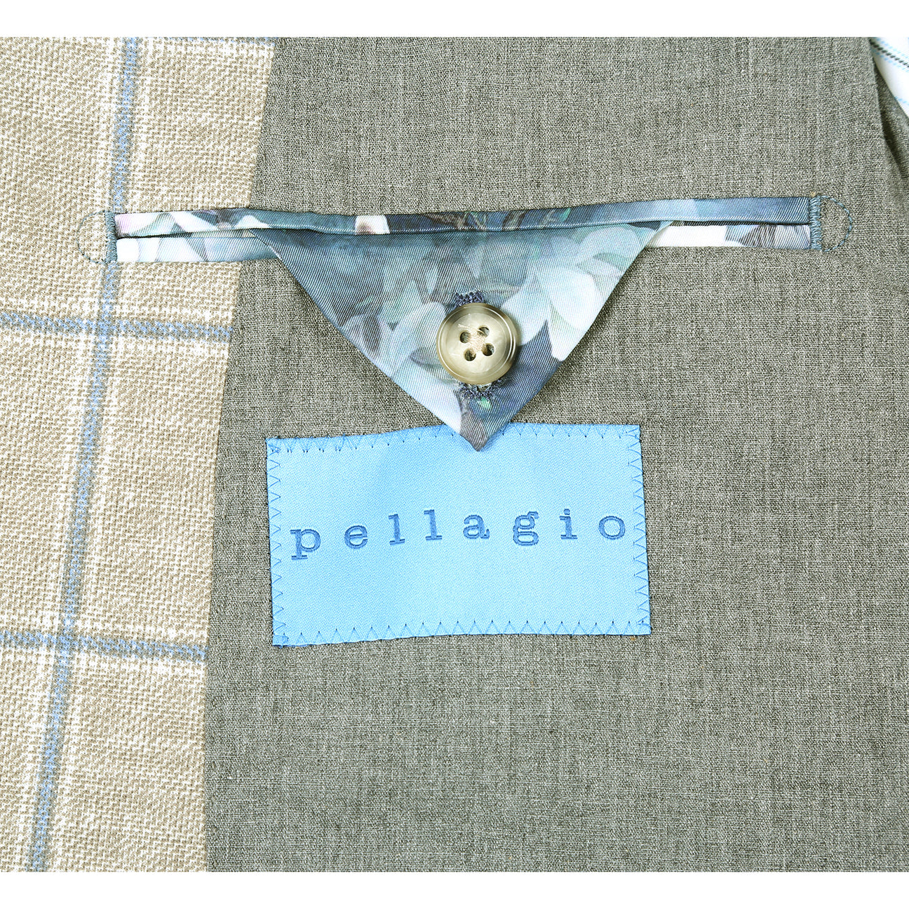 The Pellagio Green Men's Slim Fit Riserva Jacket PS26-5 by Pellagio is displayed on a mannequin with a white dress shirt, dark patterned tie, and pocket square.