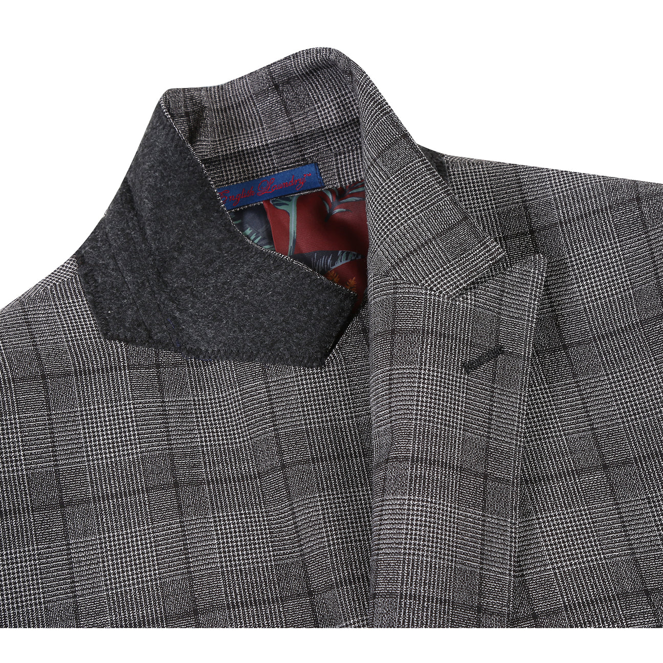 The ENGLISH LAUNDRY Gray Check Suit 22-60-002EL by English Laundry is displayed on a mannequin with a two-button closure, paired with a white dress shirt and a subtly patterned blue tie.