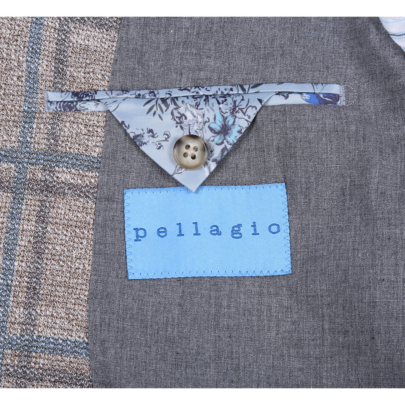 The Pellagio Camel Men's Slim Fit Riserva Jacket PS26-13 is styled on a mannequin with a white shirt, green patterned tie, and blue pocket square for a refined slim fit look.
