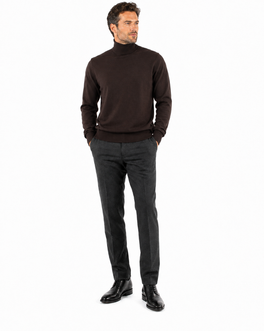 The Bassiri L/S Turtleneck Brown Sweater 631 by Bassiri is made from soft cotton and showcases long sleeves and ribbed cuffs, all against a plain background.