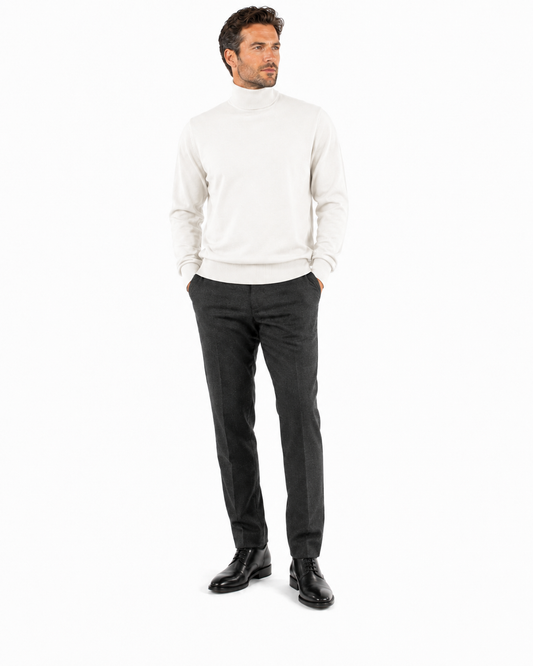 The Bassiri L/S Turtleneck Ivory Sweater 631, made from soft cotton, is showcased on a headless mannequin against a white background, offering a modern elegance to this classic piece.