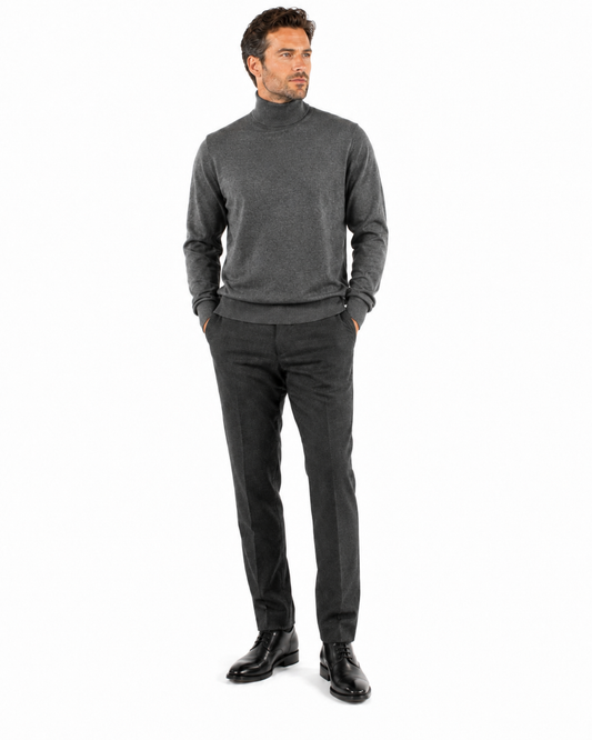 The Bassiri L/S Turtleneck Smoke Sweater 631, made by Bassiri, is crafted from soft cotton and features long sleeves. It is elegantly displayed on a mannequin against a white background.