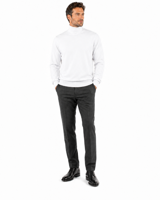Bassiri's sophisticated Bassiri L/S Turtleneck White Sweater 631, crafted from a soft blend of cotton and Tencel, is elegantly showcased on a mannequin against a plain background.