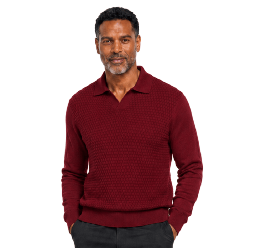 Man with short dark hair and beard wears the Bassiri Long Sleeve Collar Neck Plum Sweater 640 by Bassiri and black pants, standing against a plain light gray background.