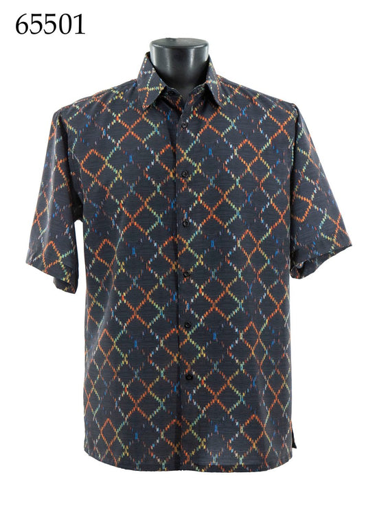 The Bassiri Short Sleeve Shirt 65501 by Bassiri features a geometric diamond pattern in orange, green, and blue on a dark background and is displayed on a black mannequin. The number 65501 appears in the top left corner.