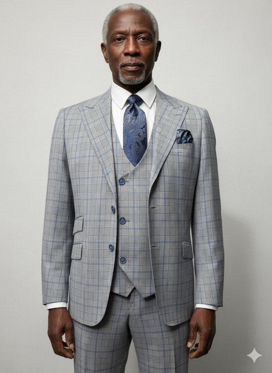 A man stands against a plain background wearing the Tiglio Luxe Prosecco Grey Plaid Blue Windowpane Modern Fit Suit (TL6373), showcasing the refined elegance and modern style of Tiglio Luxe menswear.