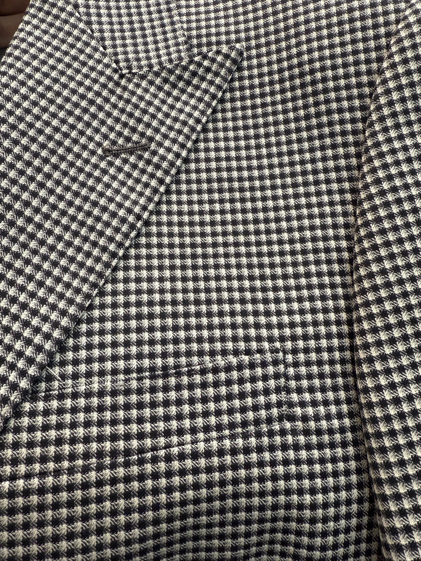 The Tiglio Luxe Prosecco suit features a black and white mini houndstooth pattern in modern fit pure wool, including a single-breasted blazer, double-breasted vest, and matching trousers—luxury tailoring at its finest.