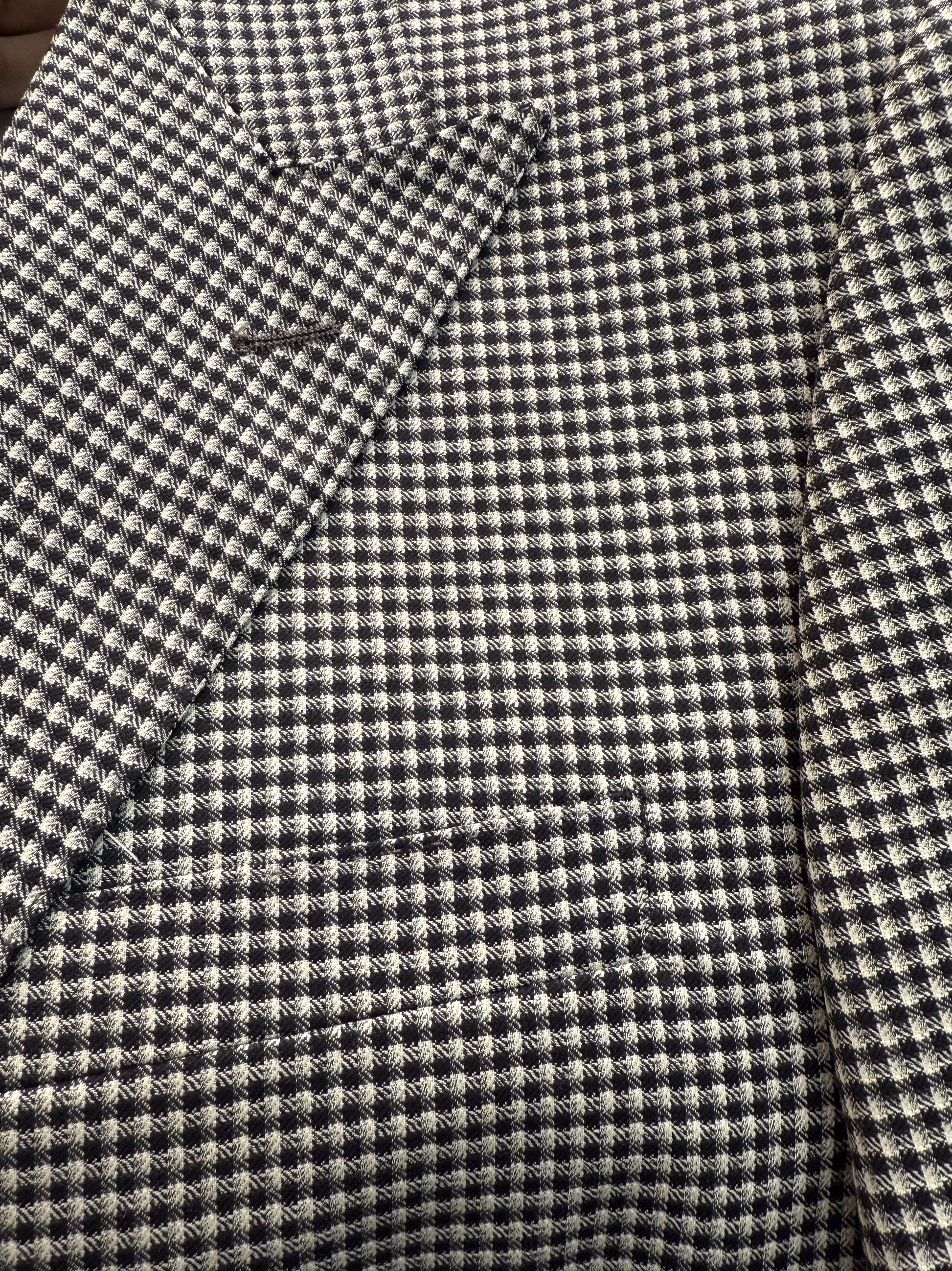 The Tiglio Luxe Prosecco suit features a black and white mini houndstooth pattern in modern fit pure wool, including a single-breasted blazer, double-breasted vest, and matching trousers—luxury tailoring at its finest.