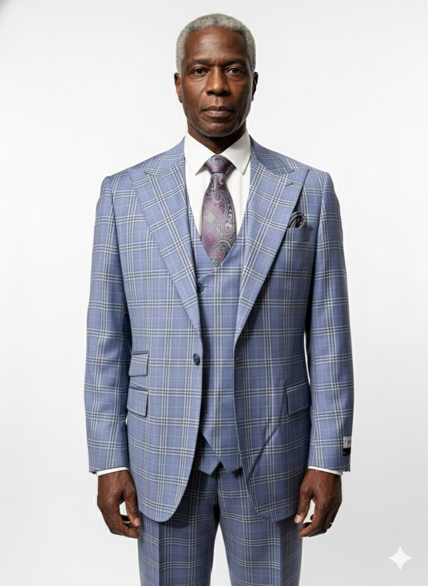 A man stands facing forward against a white background, dressed in the Tiglio Rosso Orvietto Blue Plaid Semi Wide Leg TL9337 three piece suit by Tiglio Rosso, paired with a white shirt and patterned tie.