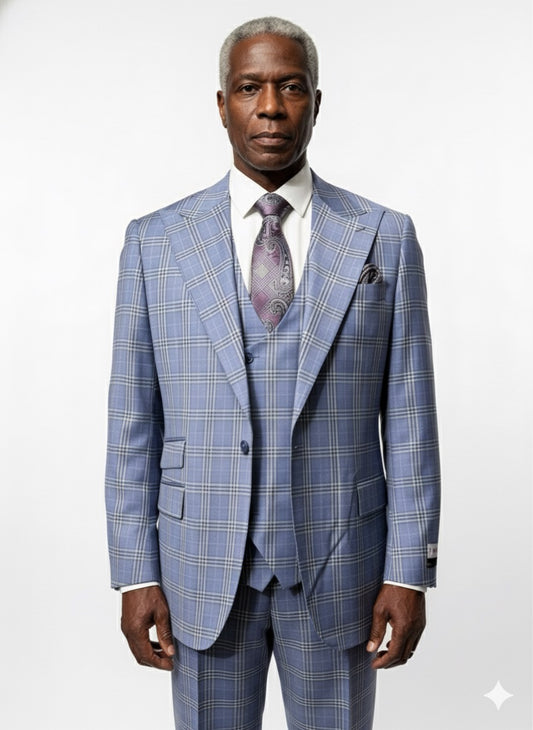 A man stands facing forward against a white background, dressed in the Tiglio Rosso Orvietto Blue Plaid Semi Wide Leg TL9337 three piece suit by Tiglio Rosso, paired with a white shirt and patterned tie.
