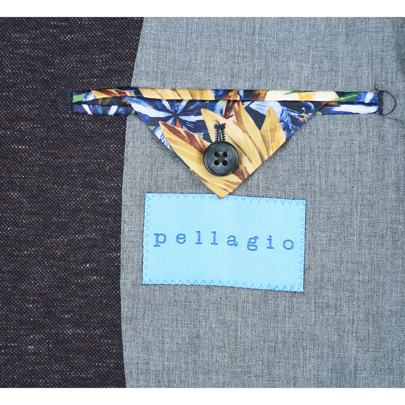 A mannequin dressed in the Pellagio Dark Gray Men's Half Canvas Blazer PF24-2, featuring a notched lapel and two buttons, over a white shirt, striped tie, and colorful pocket square.
