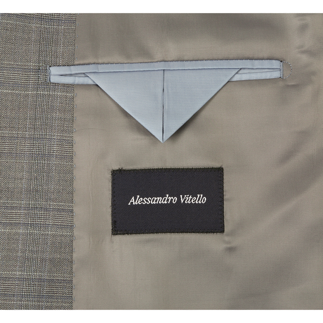 The Renoir Alessandro Vitello by Renoir Classic Fit Wool Suit 566-12, a gray plaid men's two-button jacket with notch lapels, is styled on a mannequin with a white dress shirt and red patterned tie.