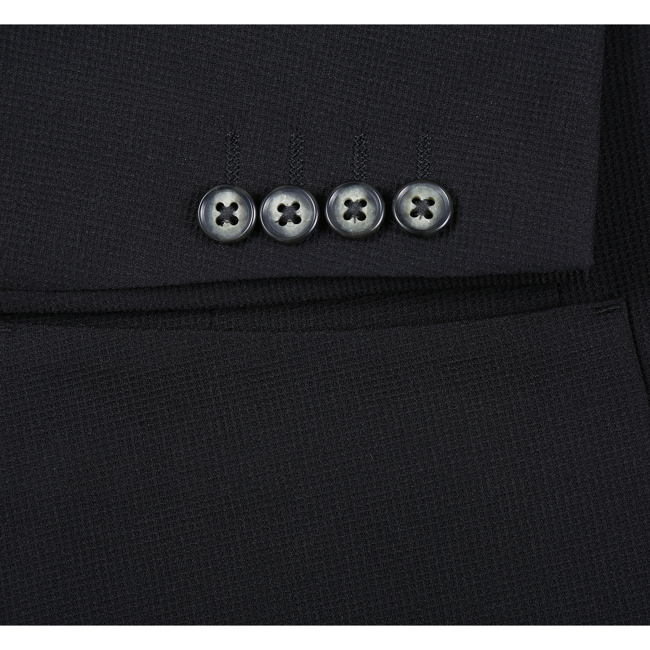 The Pellagio Men's Half Canvas Blazer Black PS25-18, a slim-fit single-breasted jacket with notched lapel, is styled on a mannequin with a white shirt, light patterned tie, and teal pocket square.