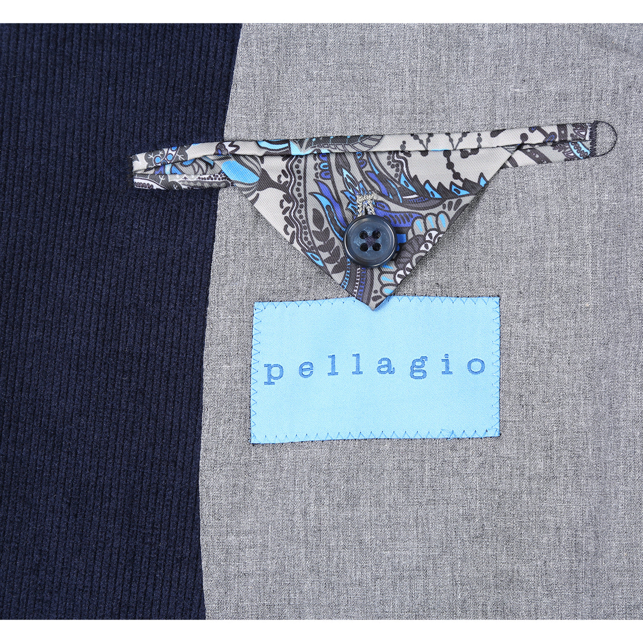 The Pellagio Navy Blue Men's Half Canvas Blazer (PF24-9), featuring a slim fit, single-breasted design, two buttons, and notched lapel, is paired with a crisp white shirt and red polka dot tie. It includes two front pockets and a stylish patterned pocket square.