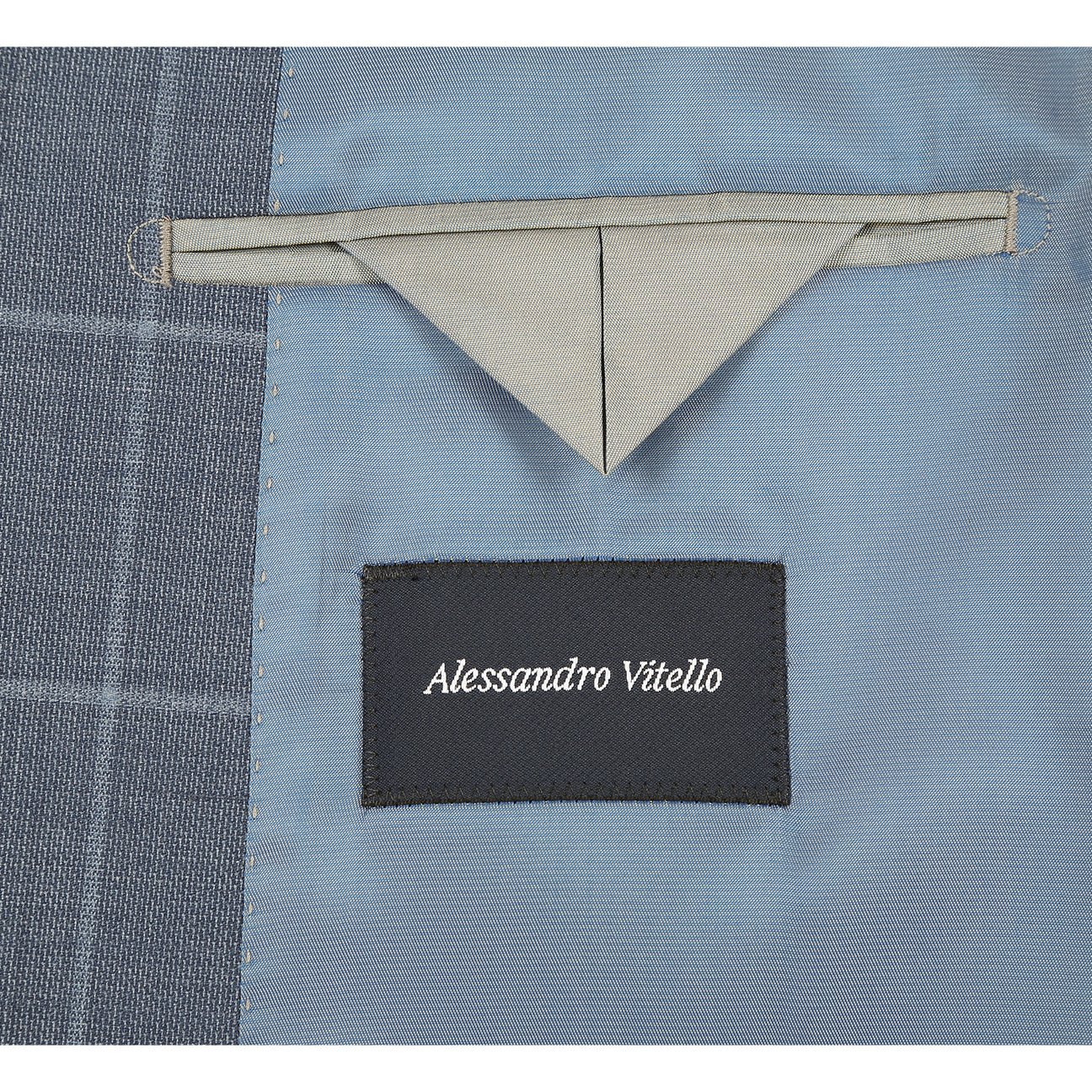 The Renoir Alessandro Vitello Slim Fit Wool Midnight Haze Suit 566-13 features notch lapels and a single-breasted design, paired with a white shirt and orange striped tie, shown on a headless mannequin. Crafted from premium wool blend for comfort and style.