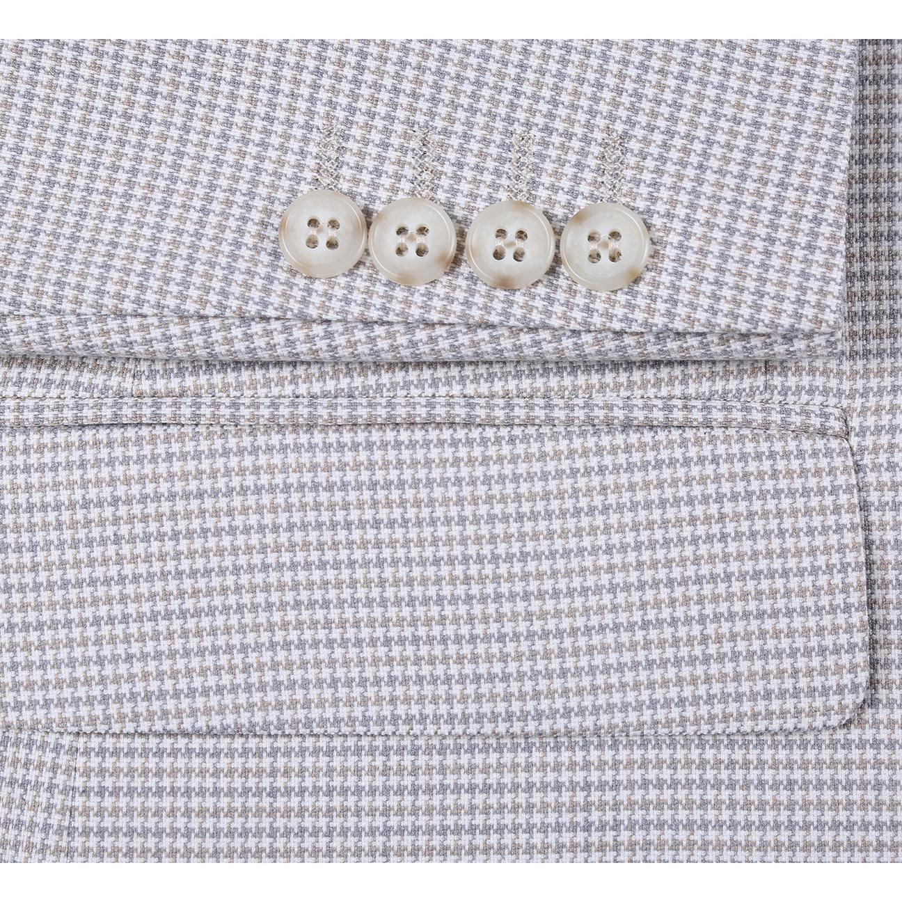The Alessandro Vitello by Renoir Classic Fit Bib Light Beige Blazer 294-66 is displayed with a white dress shirt, dark patterned tie, and pocket square. This Renoir blazer features a notch lapel, two-button closure, and classic fit style.