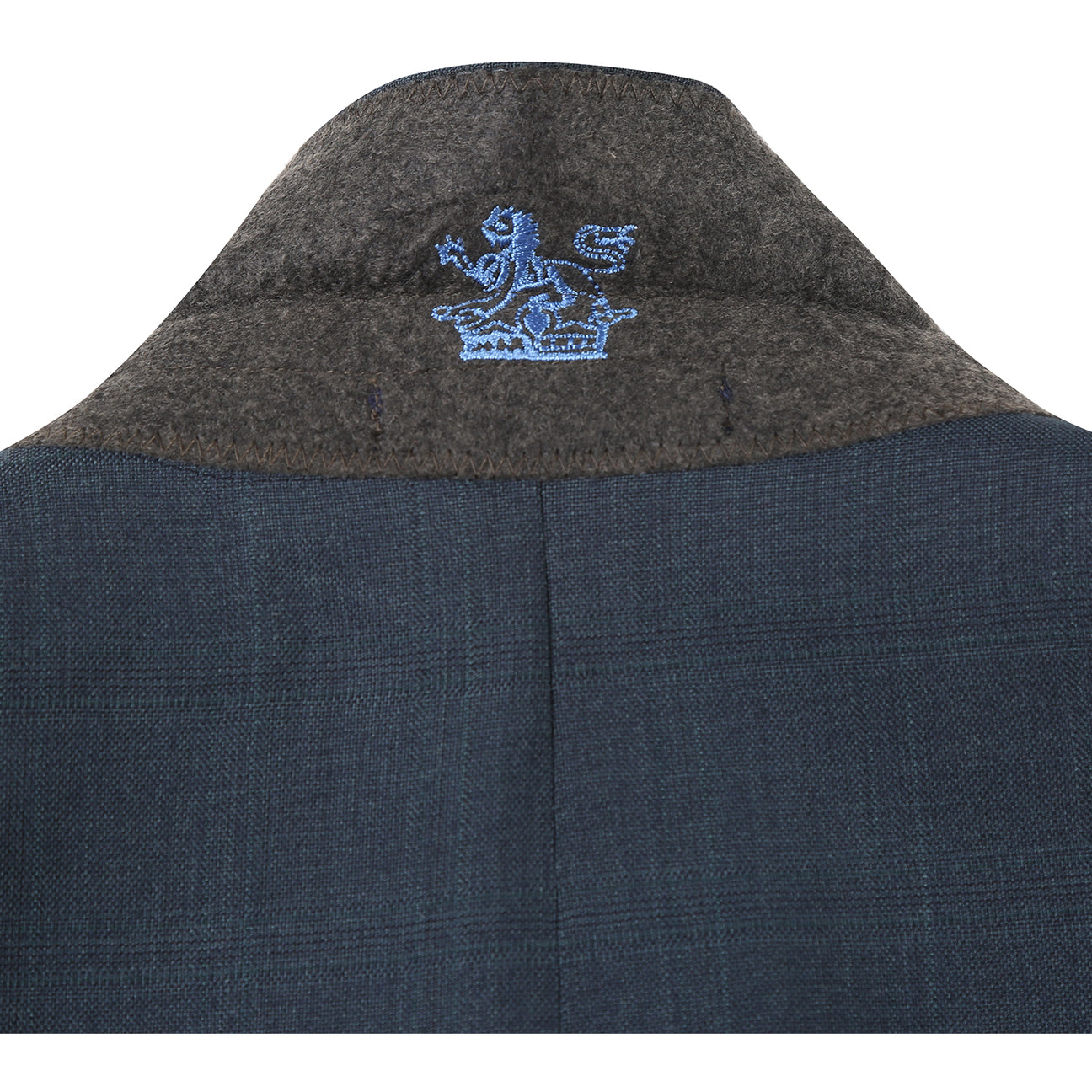 The English Laundry ENGLISH LAUNDRY Dark Green Check Suit 22-52-341EL features a men's suit jacket in dark green check with notch lapels and a two-button closure, styled over a white dress shirt and black striped tie on a mannequin.