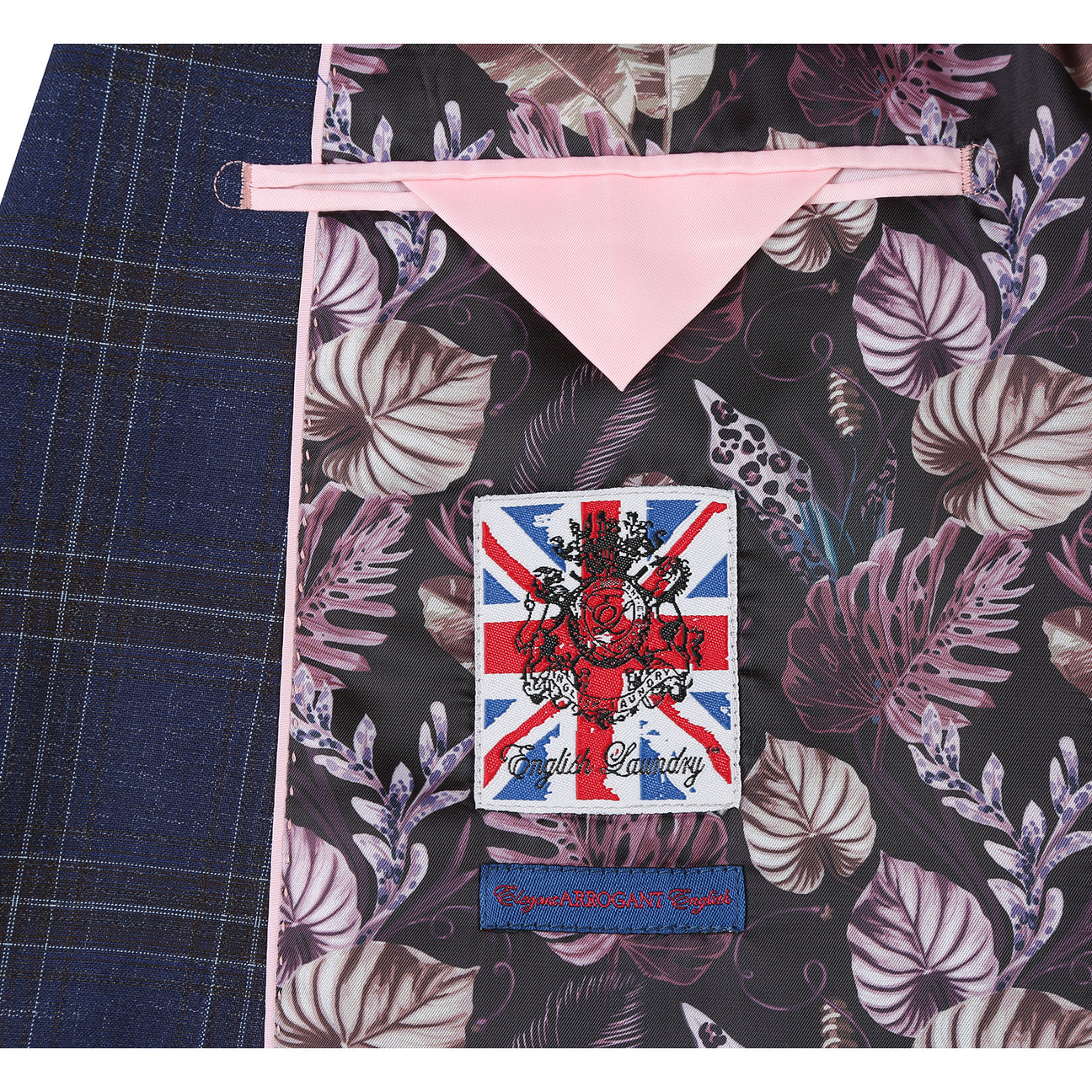 The ENGLISH LAUNDRY TR Suit 12-52-410EL by English Laundry is a slim fit blue plaid jacket with notch lapels, two buttons, and flap pockets, styled over a white dress shirt and red patterned tie on a display mannequin.