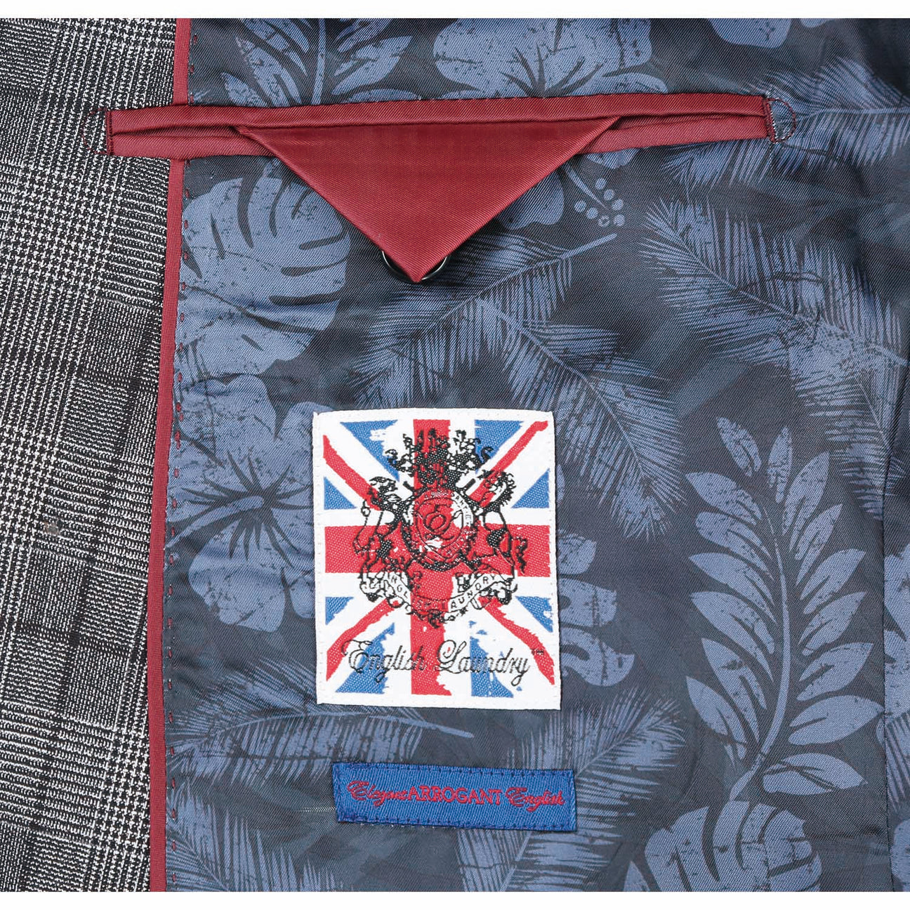 A sophisticated ENGLISH LAUNDRY Double-Breasted Black with White Check Slim Fit Suit by English Laundry, paired with a crisp white dress shirt and a blue striped tie, elegantly displayed on a mannequin.