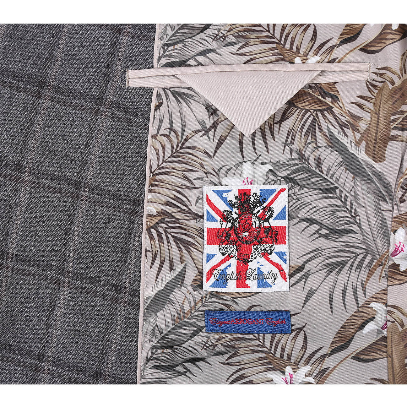 The English Laundry Double-breasted Gray Check Suit 22-50-092EL features peak lapels, matching buttons, and flap pockets, styled with a white dress shirt and red patterned tie for timeless men's formalwear.