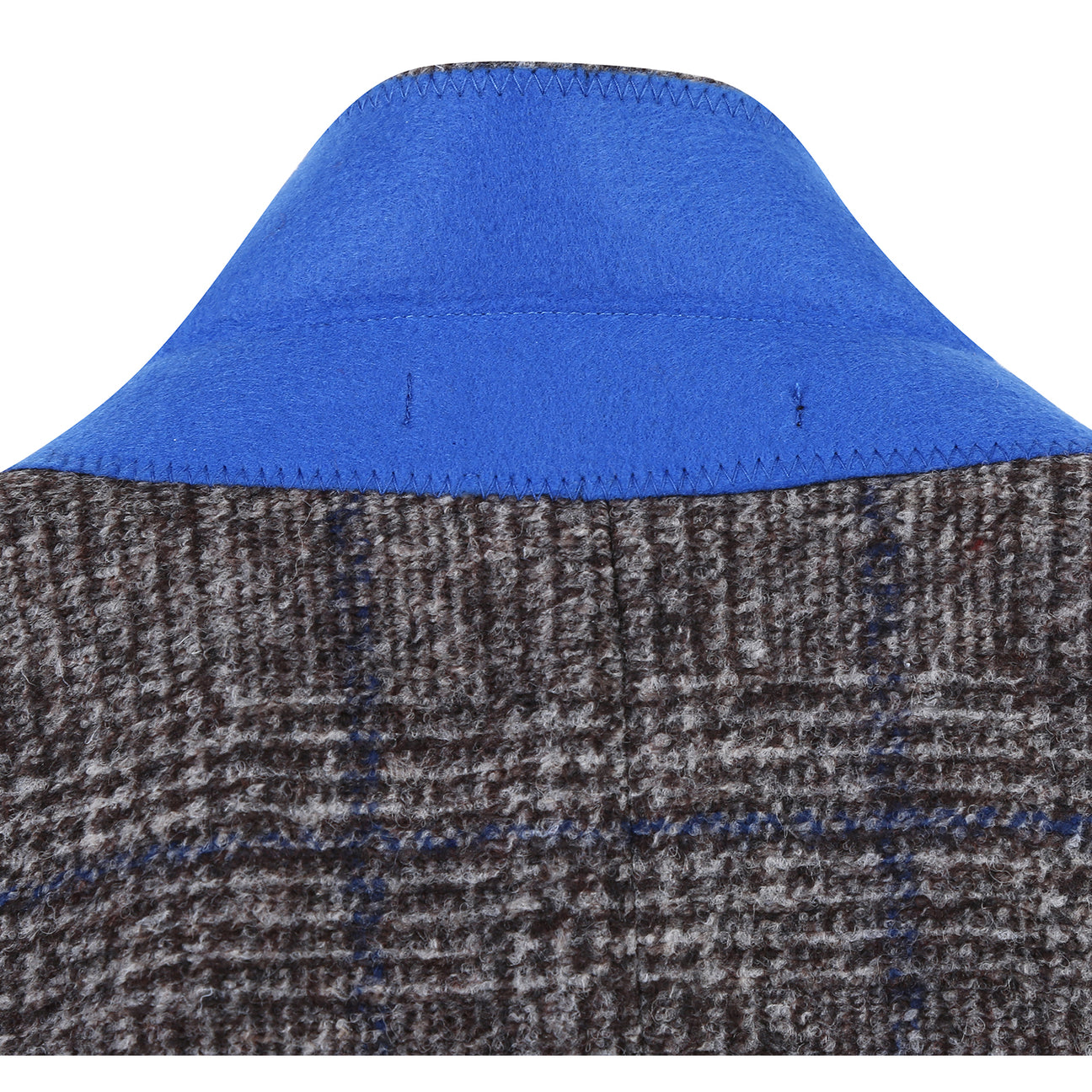 A mannequin showcases a Pellagio Beige Men's Half Canvas Blazer PF24-14, paired with a crisp white shirt and blue tie. A matching blue pocket square is elegantly tucked into the chest pocket for added sophistication.