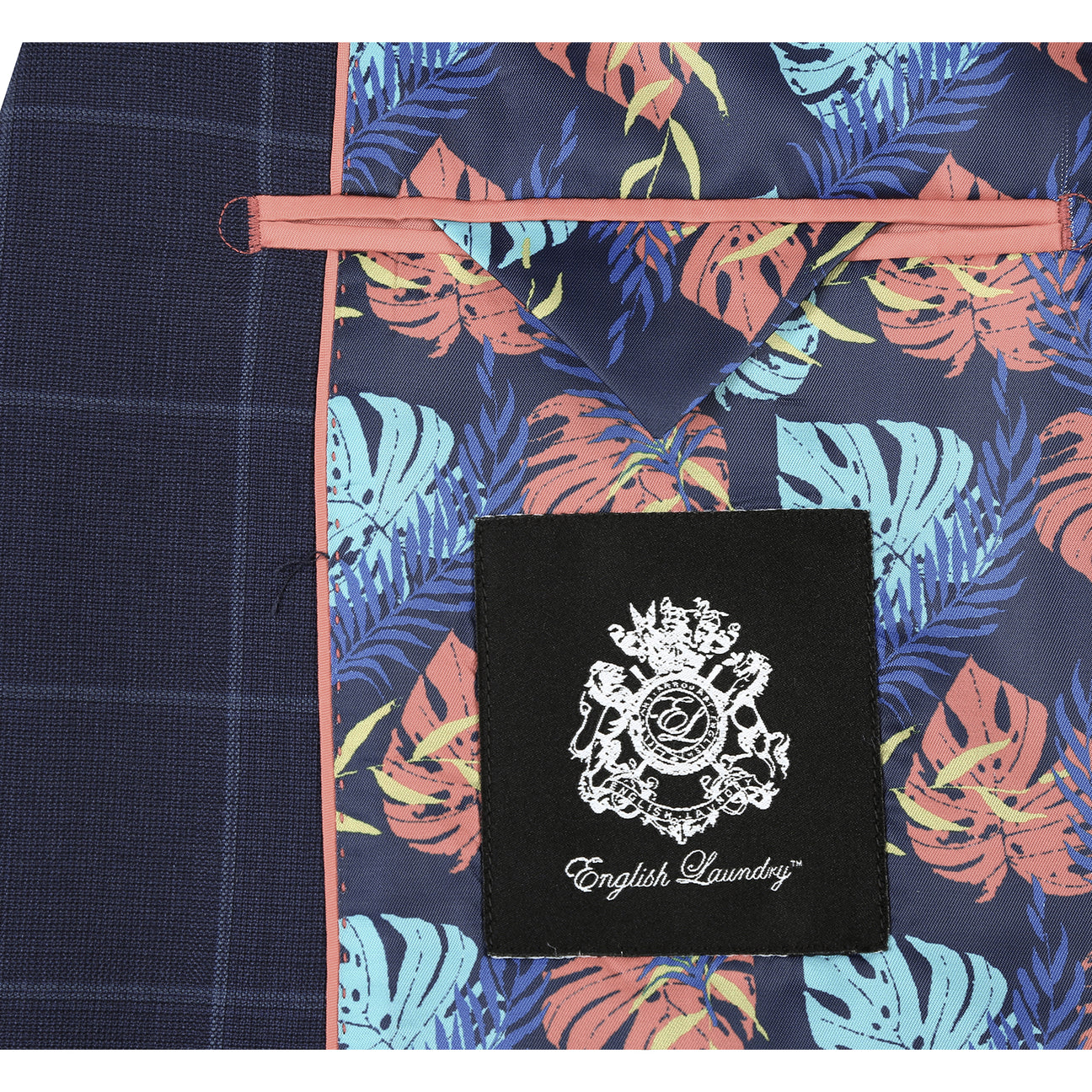 The ENGLISH LAUNDRY Blue Wool Suit EL92-52-410 by English Laundry, featuring notch lapels and a sharp slim fit, is styled on a mannequin with a white shirt and burgundy dotted tie.