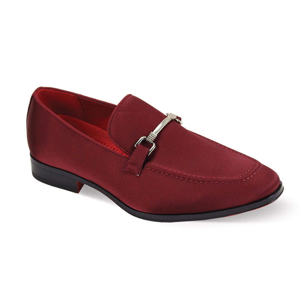 The After Midnight 7018 Burgundy Satin Loafer from AFTER MIDNIGHT features a maroon hue, sleek buckle accent, and black sole, viewed from an angle.