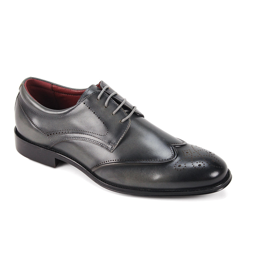 The Giorgio Venturi Giorgio 7077 Grey Leather Shoes feature classic wingtip brogue detailing, a lace-up closure, and a low heel, shown on a white background.