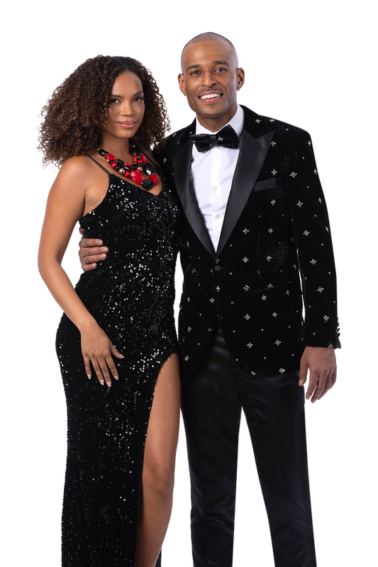 A woman in a black sequin dress and a man wearing the EJ SAMUEL Black Blazer J205 stand together, posing for a formal portrait against a white background.