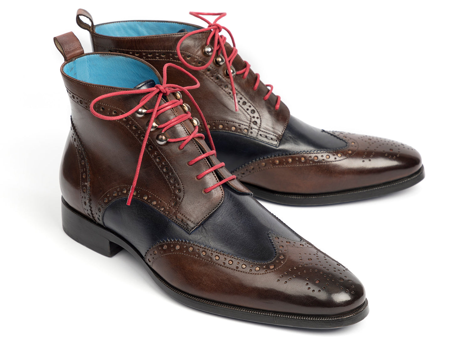 The Paul Parkman Wingtip Ankle Boots Dual Tone Brown & Blue (777-BRW-BLU) feature brown and navy leather with pink laces and decorative perforations, shown on a white background.