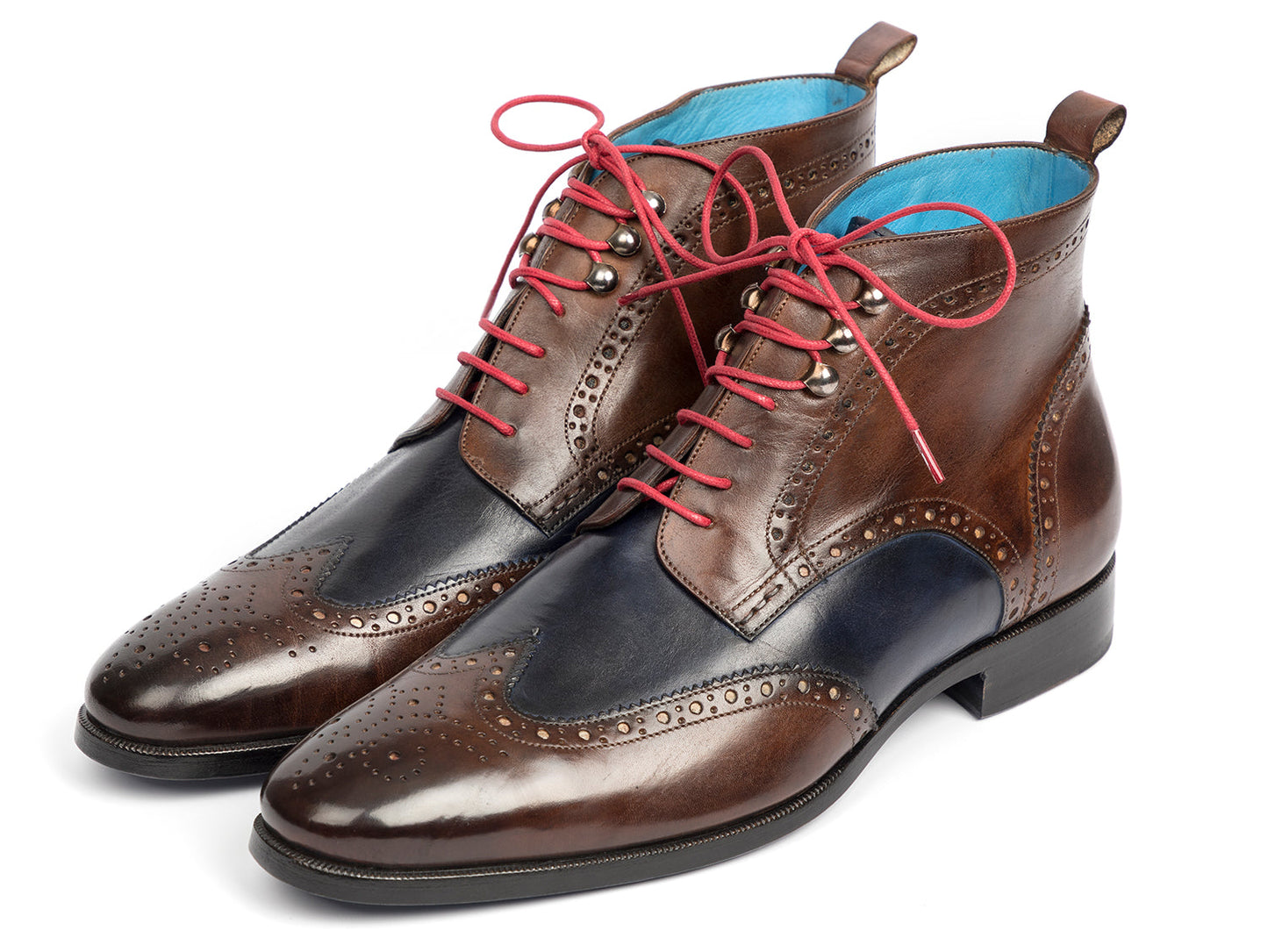 The Paul Parkman Wingtip Ankle Boots Dual Tone Brown & Blue (777-BRW-BLU) feature brown and navy leather with pink laces and decorative perforations, shown on a white background.