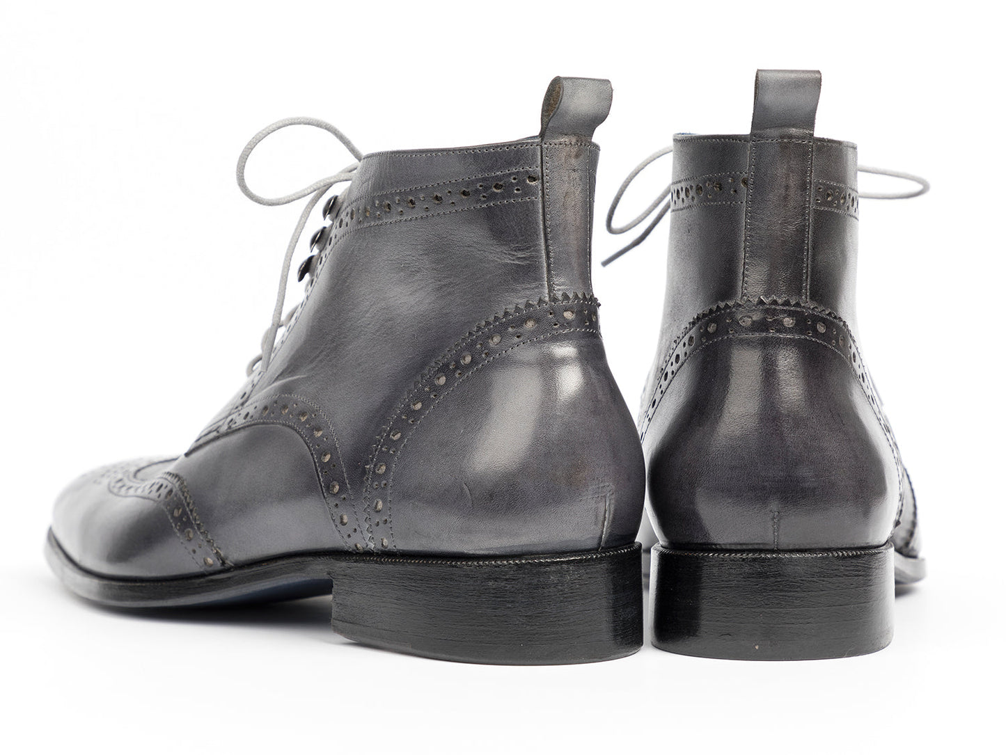 The Paul Parkman Wingtip Ankle Boots Gray Hand-Painted (777-GRAY) feature black hand-painted leather, light gray laces, and a blue inner lining, shown on a white background.