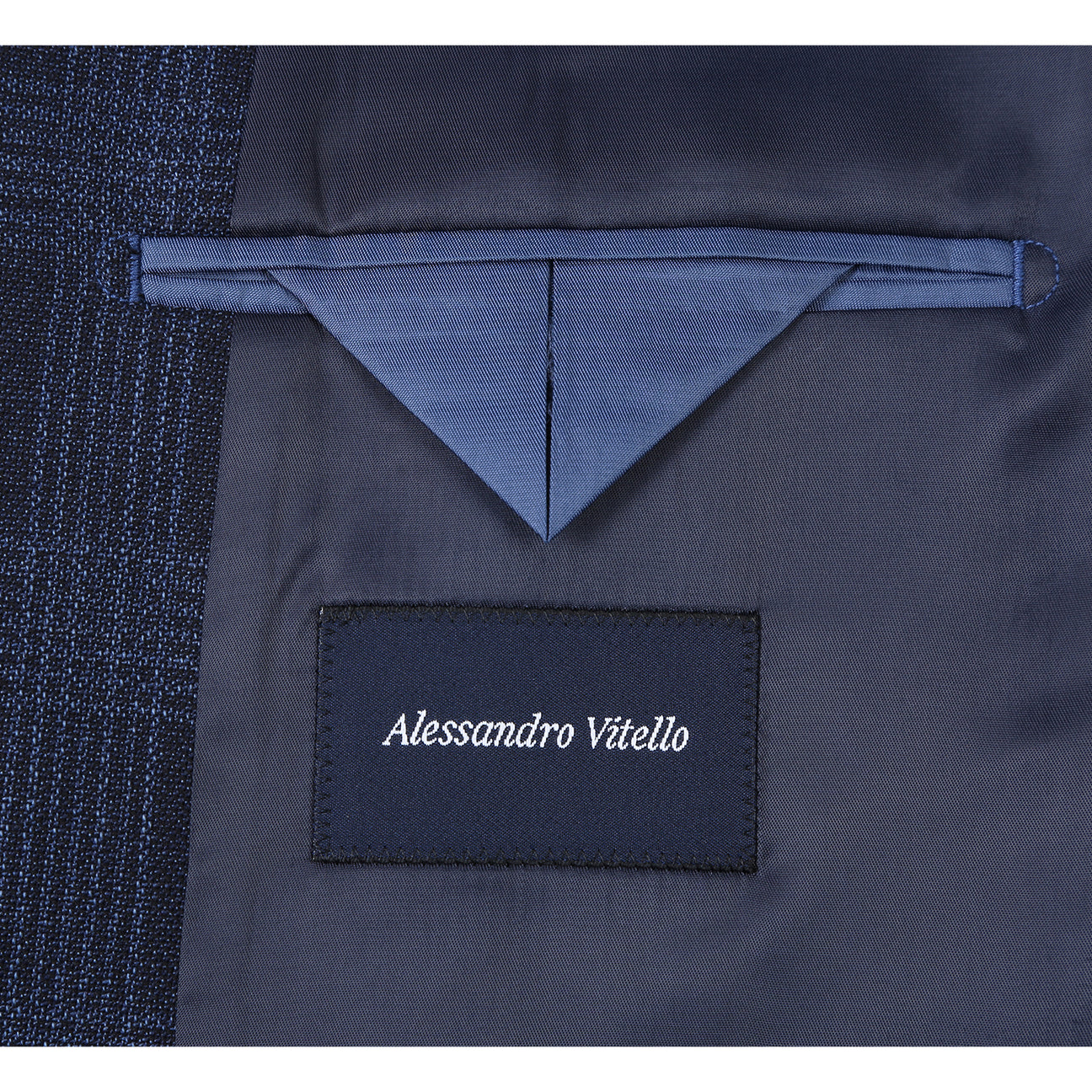 The Renoir Alessandro Vitello New Slim Fit Wool Navy Blazer 565-19 is shown on a mannequin with a white dress shirt, red polka dot tie, and blue pocket square.