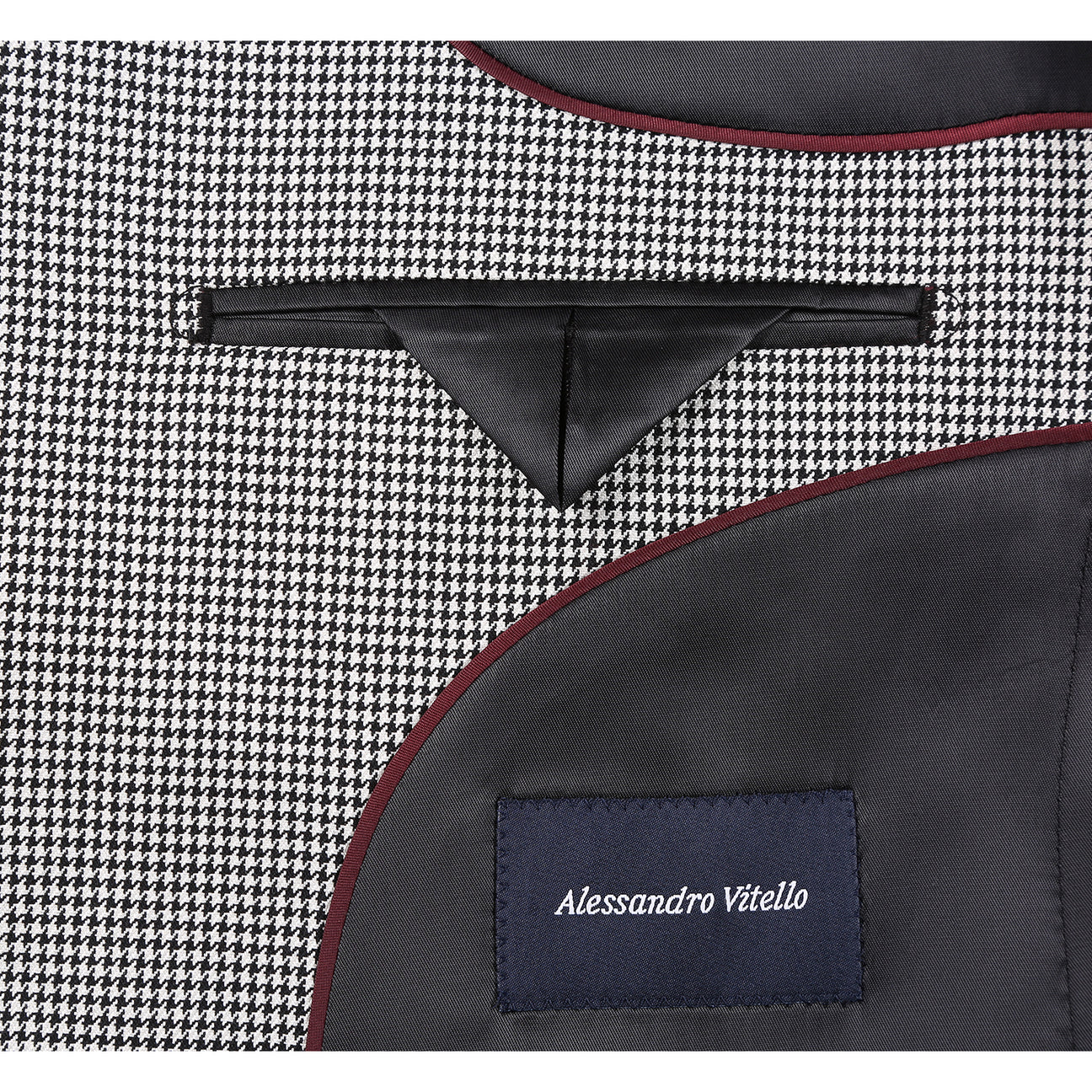 The Alessandro Vitello by Renoir New Slim Fit Wool Off White Black Blazer 565-20 by Renoir, shown with a white dress shirt and striped tie on a headless mannequin.