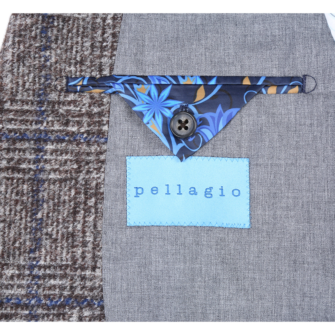 A mannequin showcases a Pellagio Beige Men's Half Canvas Blazer PF24-14, paired with a crisp white shirt and blue tie. A matching blue pocket square is elegantly tucked into the chest pocket for added sophistication.